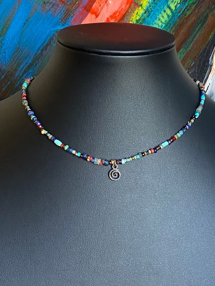 Gorgeous and delightful tiny bead BOHO choker for Men and Women. Tiny silver swirl pendant. PLEASE READ:  Chokers can vary in colors and specific beads. Options are based on premium MaRV bead mixes and will differ slightly for every necklace made. Made to order. Totally Fun! Great for layering. Unisex! I have 4 in stock that are ready to ship. They are listed separately.) Bead mix  includes: Ancient Djenne beads, ancient African trade beads, ancient Roman glass beads, Labradorite, faceted hematite, genuine turquoise, ancient Venetian glass, TOHO seed beads, garnet, lapis, Czech fire polished glass, peridot, quartz, crystal. (Not all necklaces with have every bead listed) (Ancient beads are over 2,000 years old) Free gift of the month and free shipping for purchases over $35. Exclusive Stud Jewelry 2024, Ancient Roman Glass, Easy Jewelry, Necklace Ideas, Boho Choker, African Trade Beads, Roman Glass, Handmade Wire Jewelry, Hand Stamped Jewelry