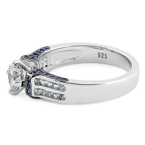 Top of ring height: 7.3mm

Top of ring width: 7.7mm

Band width: 4.8mm

Shank width: 3.4mm



Stone material: blue & clear cubic zirconia

Center stone size: 6mm

Stone shape: round & emerald cut

Center stone carat weight: .84 ct.

Total number of CZ stones: 55

Stone setting: prong & channel setting



Metal: 925 sterling silver

Plating: rhodium plated

Finish: high polish Cubic Zirconia Diamond Ring With Side Stones For Promise, Promise Diamond Ring With Side Stones In Cubic Zirconia, Promise Rings With Side Stones In Cubic Zirconia, Silver Promise Rings With Side Stones, Round Channel Set Lab-created Sapphire Jewelry, Round Lab-created Sapphire Jewelry With Channel Set, Anniversary Sapphire Ring With Side Stones In Round Cut, Sapphire Diamond Ring With Side Stones For Promise, Anniversary Sapphire Ring With Round Cut Side Stones