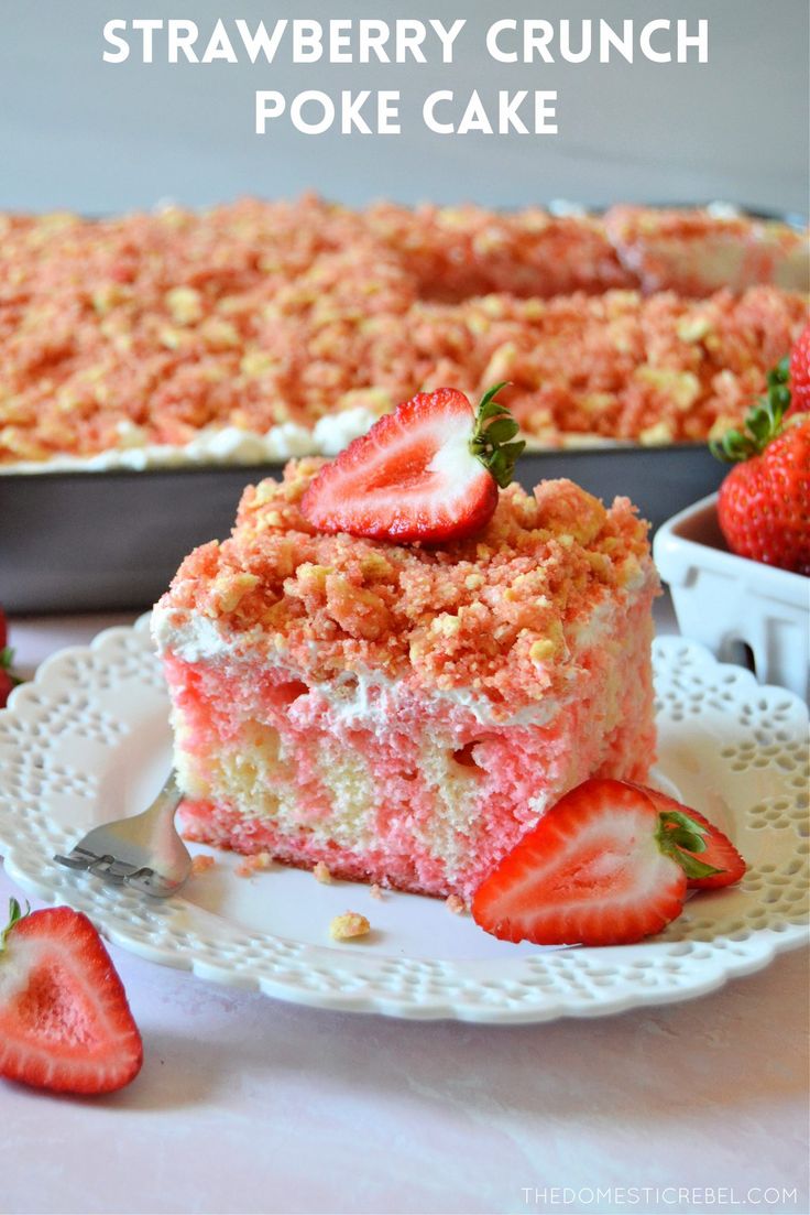 strawberry crunch poke cake on a plate with strawberries