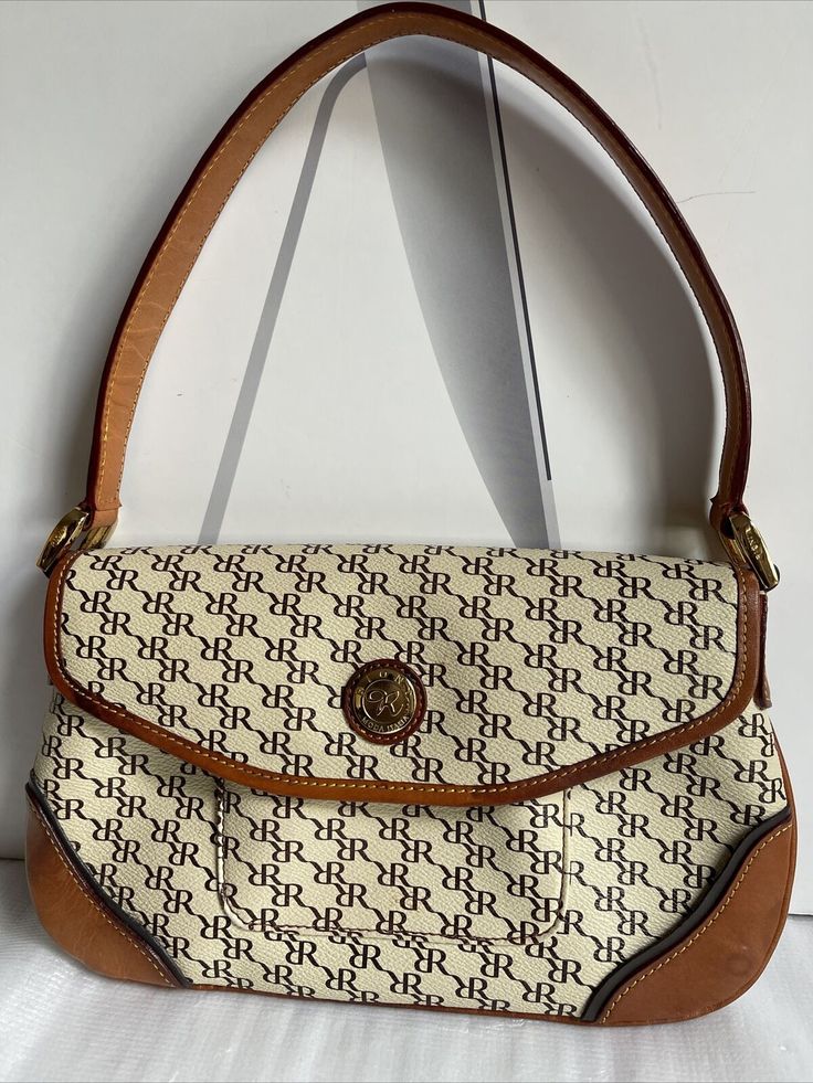 Rioni Moda Italia R Signature Beige/brown Leather Trim shoulder handbag Small Pre-Owned: In Excellent Used Condition. Normal Signs Of Wears. Strap Drop: 8 inches R Signature, Shoulder Handbag, Small Handbags, Beige Brown, Leather Trim, Michael Kors Monogram, Shoulder Handbags, Leather Trims, Bags Handbags