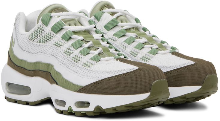 Low-top paneled mesh, buffed leather, and jersey sneakers in green and white. · Lace-up closure · Logo flag at padded tongue · Padded collar · Swoosh embroidered at outer side · Logo embossed at heel tab · Mesh lining · Air sole unit at sculptural rubber midsole · Treaded rubber outsole Please note that this item may be shipped only within North America. Supplier color: White/Medium olive/Oil green Green Sports Sneakers With Textured Sole, Green Sneakers With Textured Sole For Sports, Green Sporty Sneakers With Textured Sole, Green High-top Sneakers With Textured Sole, Nike Sale, Air Max 95, Nike Green, Green And White, Sneakers White