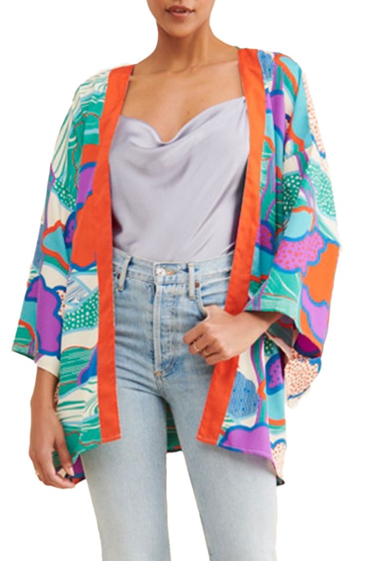 Top off your look with this lightweight ruana framed by loose-fitting sleeves and patterned with a colorful print. 100% polyester Hand wash, line dry Imported Multicolor Graphic Print Summer Outerwear, Multicolor Graphic Print Outerwear For Summer, Summer Oversized Graphic Print Outerwear, Summer Oversized Outerwear With Graphic Print, Multicolor Wrap Spring Outerwear, Multicolor Wrap Outerwear For Spring, Spring Multicolor Wrap Outerwear, Multicolor Floral Print Outerwear One Size, Multicolor Floral Print One-size Outerwear