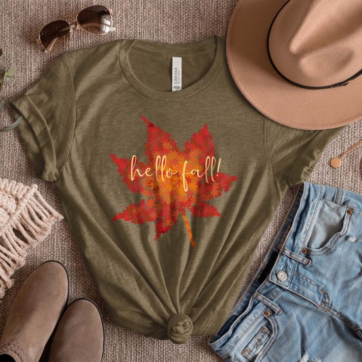 Everybody loves Fall season! This unique gift captures the fall spirit in a compelling design. It features vivid colors on a shirt that is as soft as it is comfortable. Plus, it's available in Black, Heather Olive, Forest and Heather Team Purple. 👌PERSONALIZATION: Looking for different wording on your shirt? Change the slogan from "Hello Fall" to anything you like in the personalization space below. 👉 FEATURES: * Easy Customization * Vivid & Durable Graphic  * True Fit Wear * Love It Guarantee Leaf Shirt, Fall Tree, Leaves Fall, Maple Leaves, Hello Fall, Fall Shirt, Birthday Gift For Her, Gift Store, Hello Autumn