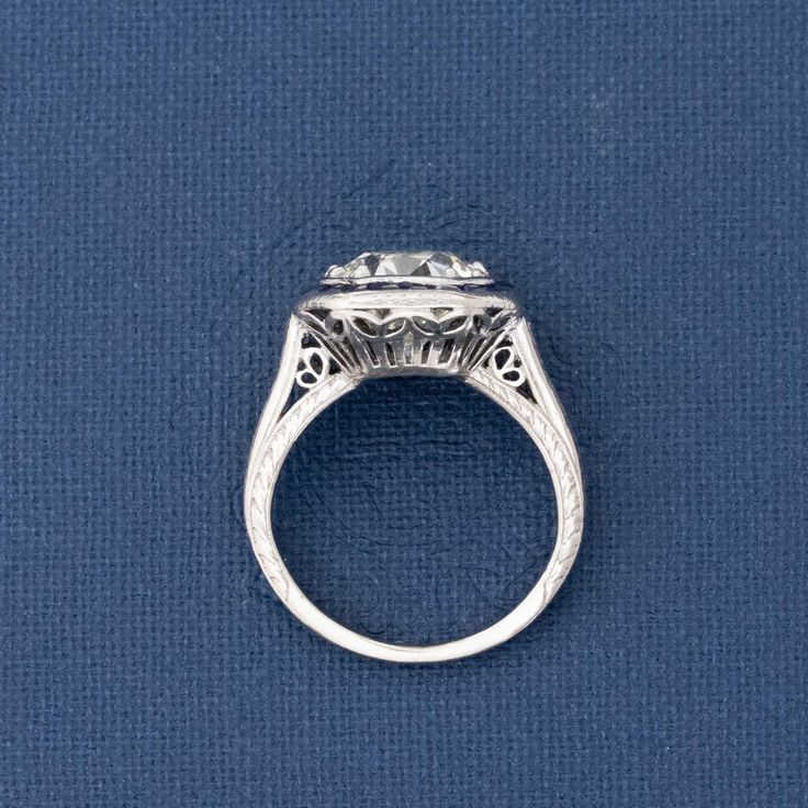 Only beyond obsessed with this antique target ring, set with a gorgeously faceted old European cut diamond, sparkling brightly against the velvety blue sapphires. Highly sogt after, this would make for a true one of a kind engagement ring (plus, she looks like a million bucks on the finger!). Platinum Size 4 & resizable Diamond measures 8.61 - 8.71 x 5.45 mm GIA link here Video Below Art Deco Jewelry With Rose Cut Round Diamonds, Art Deco Rose Cut Round Diamond Jewelry, Rose Cut Sapphire Cluster Ring, Fine Jewelry Sapphire Ring With Rose Cut Diamonds, Formal Diamond Ring With Rose Cut Round Stone, Formal Rose Cut Diamond Ring With Round Stone, Formal Rose Cut Diamond Ring, Fine Jewelry Rose Cut Diamond Ring, Art Deco Round Sapphire Diamond Ring