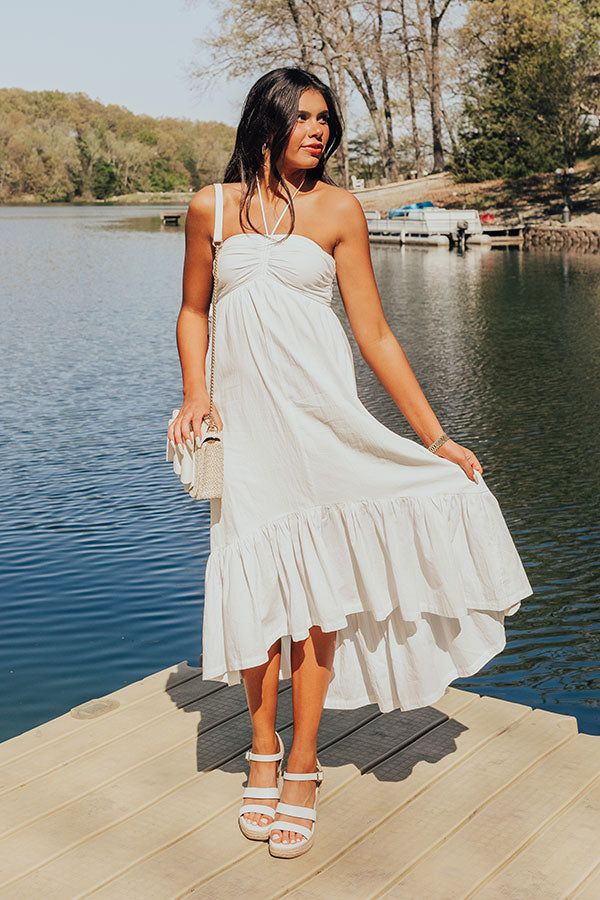 - Whether you are headed to a beachside brunch, a rooftop party, or a leisurely stroll through the park, this fabulous dress is your go-to choice for casual elegance! - Lightweight material - A built-in lining - A halter tied sweetheart neckline that goes down into a drawstring ruched detail - An interior non-slip strip - A smocked back - Functional side pockets - A flowy and flattering silhouette that ends in a ruffled high-low hemline Measurements S : Bust 26-28", Hip 42", Length 39", Slip Len Flowy Sundress For Brunch During Beach Season, Beachy Midi Dress For Brunch During Beach Season, Chic Beach Dress For Summer Parties, Chic Midi Sundress For Summer Parties, Flowy Sundress For Brunch And Vacation, Breezy Halter Neck Maxi Dress For Day Out, Breezy Maxi Dress For Vacation Brunch, Chic Halter Dress For Beach Party, Summer Halter Dress For Brunch During Beach Season