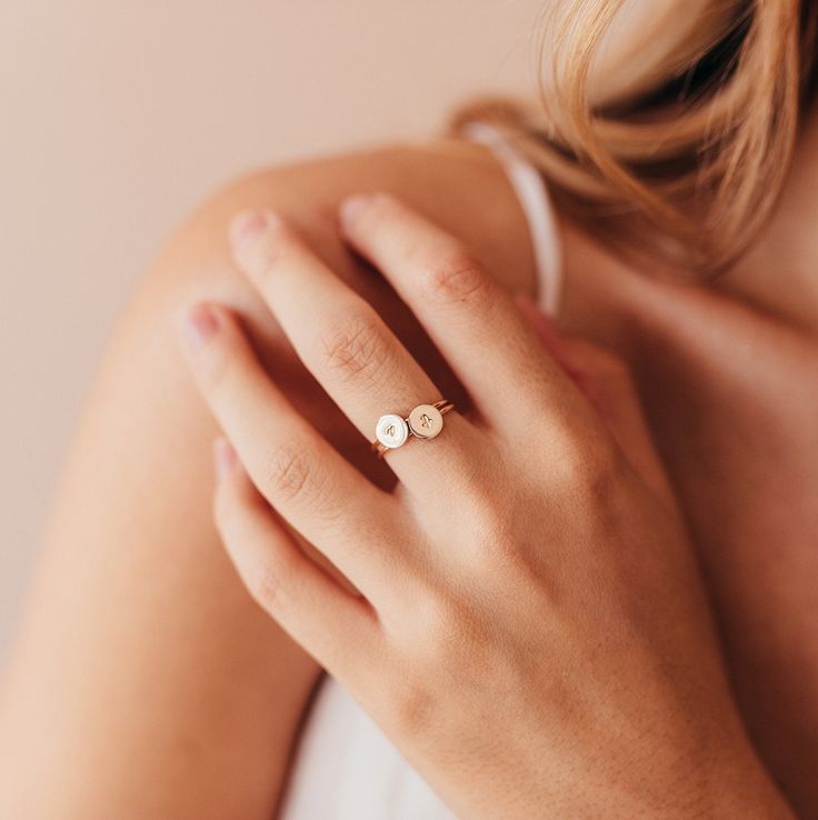 "These adorable little initial rings are made from your choice of 14k gold filled, 14k rose gold filled, sterling silver, solid 14k yellow gold or solid 14k rose gold. Each disc measures 6.4mm across. The fonts stamped on to the rings in the photos are Font 1 and Font 3, our most popular fonts! We do have more options which can be seen on the chart on the last image. H O W * T O * O R D E R: I. Choose your preferred metal from the \"Primary Color\" drop down menu. 2. Choose your preferred ring s Friendship Rings, Mother Rings, Birthday Ring, Initial Ring, Personalized Rings, Metal Stamping, Minimalist Jewelry, Custom Rings, Gold Rose