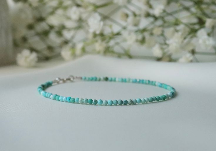 "This ultra skinny delicate gemstone bracelet is made of Genuine hight quality AAA Hubei Turquoise. Perfect December birthstone present for someone special.  A beautiful pop of happy color <3  The bracelet is made with real turquoise beads (1-1.5 mm) and sterling silver clasp. It is a symbol of friendship and stimulates romantic love. Turquoise is a stone of communication (5th Chakra). . 🔸 MEASUREMENTS🔸 ▪️ Gemstones: Hubei Turquoise ▪️ Beads size: 1-1.5 mm ▪️ Clasp: 925 Sterling Silver ▪️ Leng Elegant Turquoise Beaded Bracelets With Tiny Beads, Dainty Turquoise Gemstone Bracelets, Elegant Everyday Turquoise Beaded Bracelet, Elegant Turquoise Beaded Bracelets As Gift, Turquoise Minimalist Hand-strung Bracelet, Elegant Amazonite Bracelets As A Gift, Minimalist Turquoise Hand-strung Bracelets, Handmade Elegant Amazonite Beaded Bracelets, Hand-strung Turquoise Minimalist Bracelets