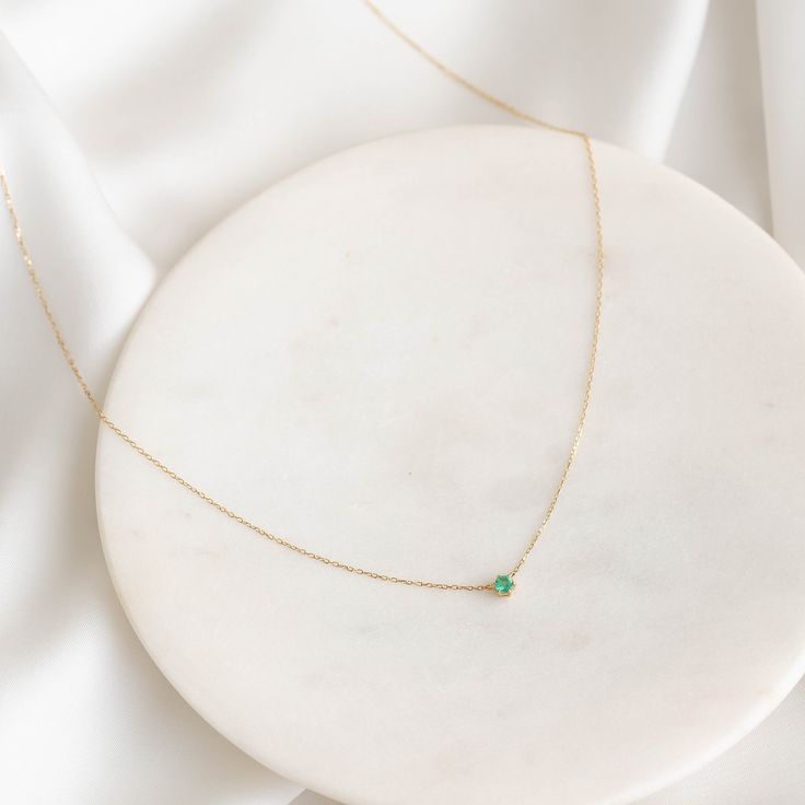 Our Amalie Necklace features an elegant emerald pendant on a 14k gold chain—a timeless addition to any jewelry collection! 


Lab grown emerald pendant measures 3mm in diameter

Necklace has an adjustable length and can be worn at 16", 17" and 18" Elegant 14k Gold Emerald Necklace With Delicate Chain, Minimalist Emerald Necklace In Yellow Gold, Elegant Green Birthstone Necklace With Delicate Chain, Emerald Pendant Necklace With Adjustable Chain For May Birthstone, Emerald Necklace With Delicate Yellow Gold Chain, May Birthstone Emerald Pendant Necklace With Adjustable Chain, Elegant Emerald Necklace With Adjustable Chain, Dainty 14k Gold Emerald Necklace, Yellow Gold Emerald Necklace With Delicate Chain