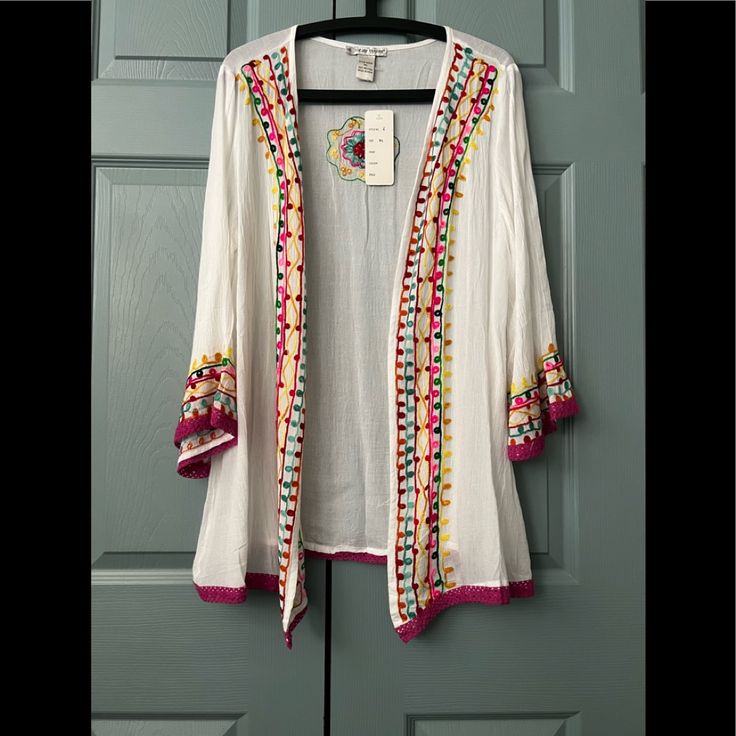 This Pretty Light Weight Cardigan Can Be Worn With A Favorite Blouse, Or With Your Bathing Suit. Material Is 100% Rayon. Summer Cotton Cardigan With Floral Embroidery, Pink V-neck Cotton Outerwear, Embroidered Open Front Cardigan, Long Sleeve Cotton Cardigan With Floral Embroidery, Pink Embroidered Long Sleeve Cardigan, Spring Floral Embroidered Long Sleeve Cardigan, White Embroidered V-neck Cardigan, Long Sleeve Floral Embroidered Cardigan For Spring, Casual Cotton Cardigan With Floral Embroidery