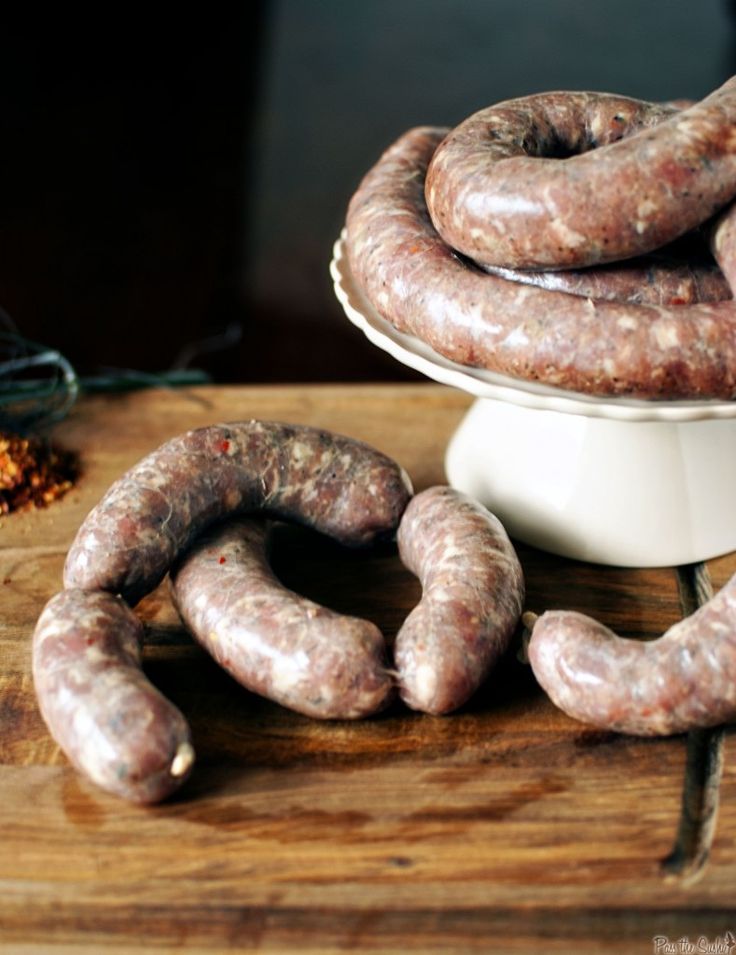 several sausages are on a wooden table