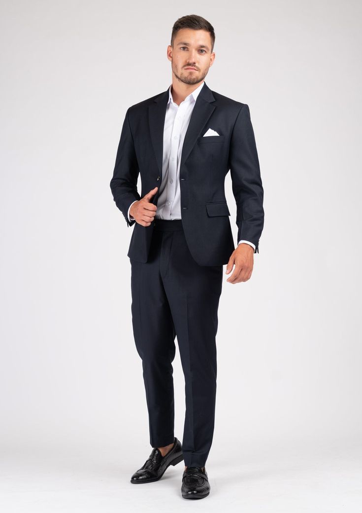 The Astor Dark Navy Twill Suit is an elegant and timeless professional wardrobe staple. Versatile for a variety of occasions, get ready to look your best in this custom made suit, wherever you wear it. Elegant Semi-formal Pantsuit With Pressed Crease, Tailored Elegant Formal Pantsuit, Tailored Elegant Pantsuit For Formal Occasions, Elegant Tailored Pantsuit For Formal Occasions, Luxury Single Breasted Workwear Set, Elegant Pantsuit With Pressed Crease, Luxury Notch Lapel Wedding Pantsuit, Luxury Notch Lapel Pantsuit For Wedding, Wedding Three-piece Suit With Welt Pockets