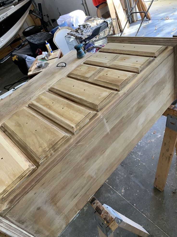 an unfinished wooden table being worked on