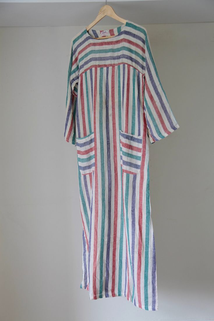 Incredible 70's made in Pakistan striped kaftan dress, you will live in this stunner all summer long! This really is a done-in-one kind of dress with the bests colours and sweet square pockets. It is a cotton/muslin sort of fabric. Condition is good, colour is still vibrant throughout. Unfortunately there are faint marks on the front and the sleeve of the garment, all of which are visible on photos, however they are not super obvious when worn. I didn't want to try and remove these marks myself Striped Long Maxi Dress For Summer, Bohemian Striped Kaftan For Summer, Bohemian Striped Tunic Dress, Striped Long Sleeve Kaftan For Summer, Striped Long Sleeve Summer Kaftan, Summer Striped Tunic Kaftan, Diy Sewing Clothes, Kaftan Dress, Muslin Cotton