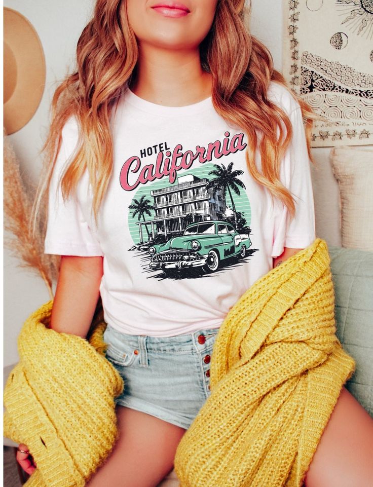 California shirt, palm trees, ocean shirt, beach shirt, summer clothing, sunshine shirt, vacation shirt, retro shirt, trendy summer shirt, My shirts, sweatshirts, and tanks are a fun and joyous way to show your style while shopping, heading to the beach, and bringing your children to social events, family outings, and everyday life. All my t-shirt designs are direct to garment and provide the best quality and longevity.  Hotel California Picture: Beach, Car, Palm Trees, Hotel Sizes: S - 2XL  Fab Retro Printed Summer T-shirt, Summer Cotton T-shirt With Palm Tree Print, Retro Funny Print T-shirt For Beach, Trendy Relaxed Fit Camp Shirt For The Beach, Spring Crew Neck T-shirt With Palm Tree Print, Trendy Cotton Beach Camp Shirt, Trendy Cotton Camp Shirt For Beach, Graphic Print Cotton Camp Shirt For Vacation, Retro Tops With Funny Print For Summer