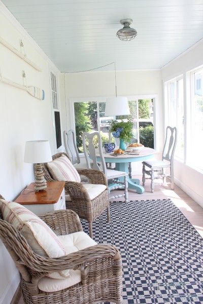 a living room filled with furniture next to a dining room table and window sill