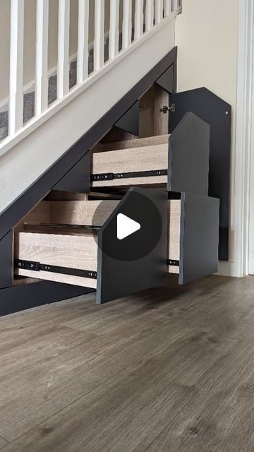 a staircase with drawers underneath it and a video player in the bottom right hand corner