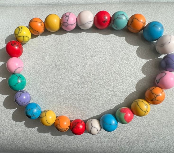 A stretch bracelet made with a rainbow of colors. The beads are ceramic style beads. Light weight and will go with any outfit. Ceramic Style, Hippie Bracelets, Rainbow Bracelet, Wilmington Nc, A Rainbow, Stretch Bracelet, Stretch Bracelets, Bracelet Making, Hippie Boho