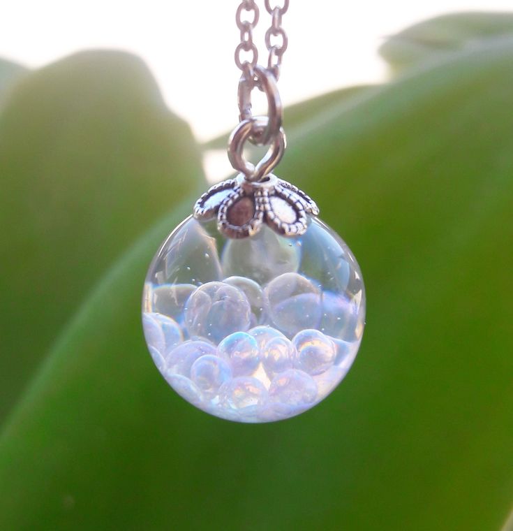 "A magical Resin Orb has beautiful \"Fairy\" Bubbles inside. Each Ball is filled with iridescent Bubbles which when held to the light reflect a few different colors. ❋The ball is 1.5 cm (0.6 inch) diameter ❋Necklace comes with a hypoallergenic Stainless Steel chain. Please choose the chain size when buying. ❋Every piece in this shop was made in several casting steps, sanded and polished by hand. ❋Please note that colours and patterns of each piece may vary slightly as it is unique and individually hand-crafted. Please also allow for  minor imperfections due to handcrafting process and material used. ❋Each finished jewelry listing will arrive ready to gift in a gift box ❋Any questions please feel free to ask :)" Fairy Globe, Faery Jewelry, Magical Necklace, Necklace Fairy, Galaxy Pendant, Jewelry Gift Ideas, Terrarium Necklace, Bubble Necklaces, Fairy Jewelry