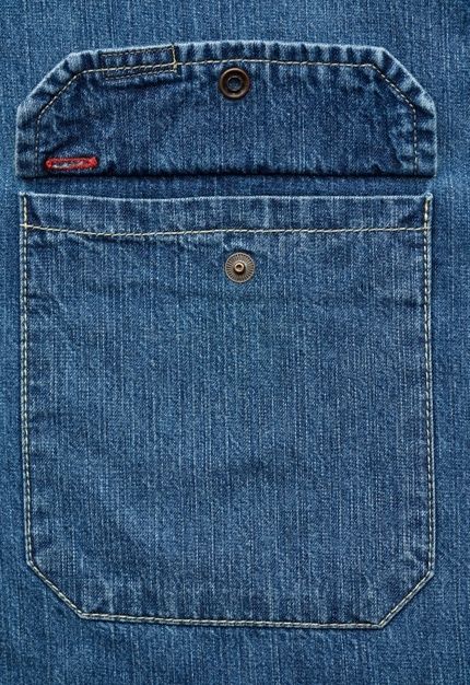 the back pocket of a pair of blue jeans with buttons on each side and one button at the bottom