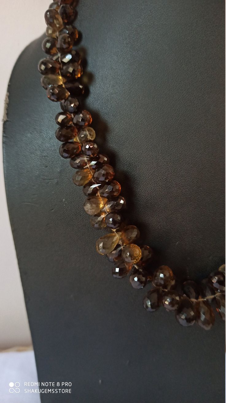 18''AAA 370 Carat Natural Beer Smoky Quartz Faceted Drop Gemstone Beads Necklace Stone :Natural Beer Smoky Quartz Shape :- Drop Size :- 5x7mm to8x11mm size - approx 18 inch Weight :-370 carat Polish :- Handmade Purity :- 100% Natural Gemstone makes a great gift for your loved ones. Click below to see live stock: https://www.etsy.com/au/shop/ShakugemsStore?ref=search_shop_redirect If for any reason you are not satisfied with your purchase. You can return it for a full refund within 5 days You may Gold Smoky Quartz Gemstone Jewelry, Elegant Faceted Smoky Quartz Jewelry, Brown Smoky Quartz Gemstone Jewelry, Luxury Gold Smoky Quartz Jewelry, Smoky Quartz Necklace, Gemstone Beaded Necklace, Drop Necklace, Smoky Quartz, Stone Necklace