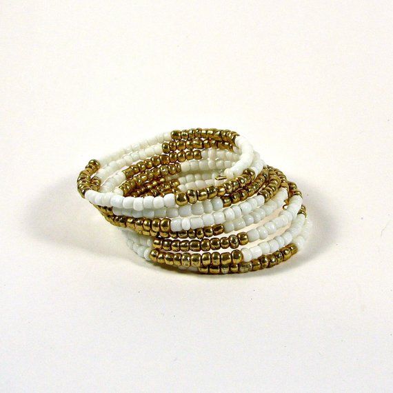 Beaded memory wire bracelet; white and gold beaded bracelet Gold Beaded Bracelet, Beaded Memory Wire Bracelets, Beaded Memory Wire, Memory Wire Bracelet, Gold Bead Bracelets, Memory Wire Bracelets, Memory Wire, Wire Bracelet, Organza Bags