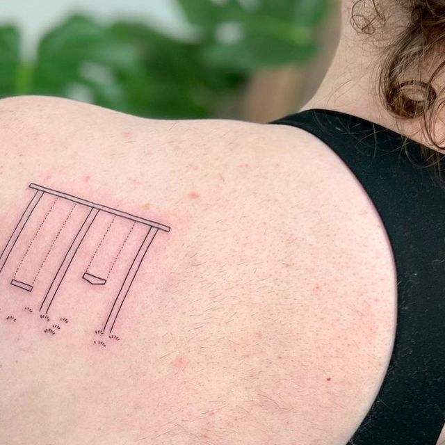 the back of a woman's shoulder with an outline of a bench on it