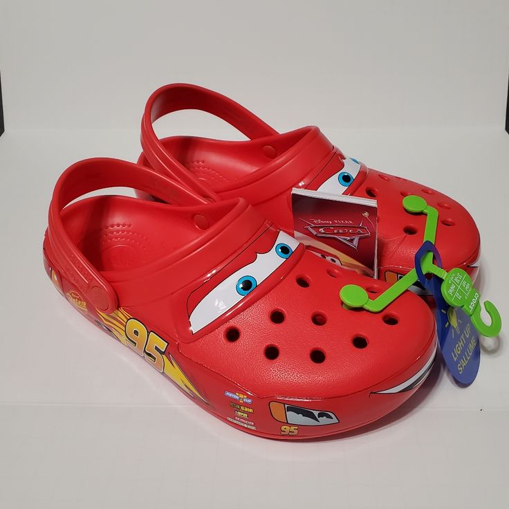 Authentic, New With Tags, Never-Worn Crocs; Lightning Mcqueen Adult Clogs Women's Size 7 Or Men's Size 5 Red Color Clogs With Light-Up Led's With Every Step Features Cool Cars Graphics And Long-Lasting Leds That Light Up With Every Step. They’re Sure To Leave The Competition In The Dust And Win New Fans Everywhere You Choose To Rev. It’s The Iconic Clog That Started A Comfort Revolution Around The World! The Irreverent Go-To Comfort Shoe That You're Sure To Fall Deeper In Love With Day After Day Red Clogs With Removable Insole And Round Toe, Red Closed Toe Clogs With Rubber Sole, Red Open Toe Clogs With Rubber Sole, Red Crocs Aesthetic, Custom Crocs Shoes Red, Lighting Mcqueen Crocs, Lightning Mcqueen Crocs, Red Closed Toe Synthetic Clogs, Lighting Maqueen Crocs