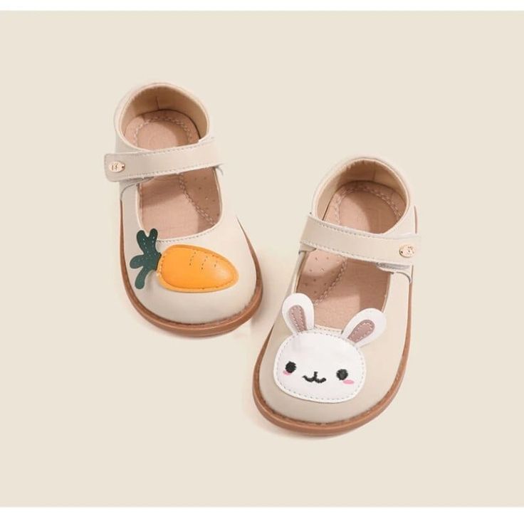 Introducing our Cartoon Rabbit Leather Flat Shoes – the perfect blend of comfort, style, and whimsical charm. Crafted with your little one's comfort in mind, these flat shoes are made from high-quality leather that's gentle on their delicate feet. The star of the show is our adorable cartoon rabbit or carrot design, adding a playful touch to your child's footwear collection. The strap ensures a secure fit, so your little explorer can hop and skip with ease while wearing these delightful shoes. W Spring Ballet Flats With Rubber Sole And Round Toe, Cream Leather Shoes With Flat Heel For Spring, Spring Leather Shoes With Removable Insole And Round Toe, Spring Leather Shoes With Round Toe And Leather Sole, Casual Non-slip Leather Shoes With Round Toe, Casual Non-slip Round Toe Leather Shoes, Playful Non-slip Sandals With Round Toe, Spring Ballet Flats With Round Toe, Pink Round Toe Flats For Spring