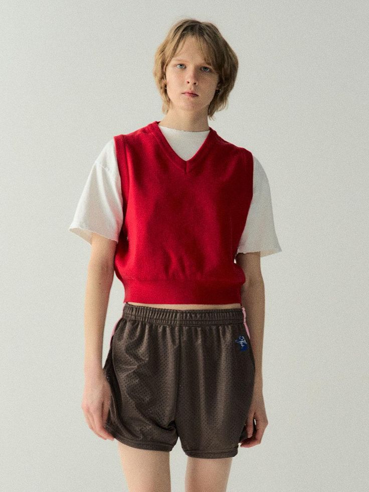 This is cute cropped vest simply accented with logo embroidery under armhole. Style yours layering over t-shirt or shirts.- V-neck - Logo embroidery- Ribbed edges- Semi-cropped length- Sleeveless- Relaxed fit Casual Red V-neck Vest, Red Cotton V-neck Crop Top, Red V-neck Cotton Vest, Red Cotton Casual Sweater Vest, Casual Red Cotton Sweater Vest, Red V-neck Cotton Crop Top, Casual Red Crew Neck Vest, Red Sporty Vest Top, Sporty Red Vest Top