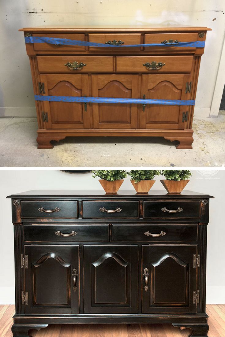 an old dresser has been painted black with blue tape and is being used as a sideboard