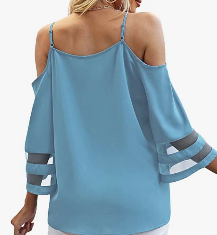 Stay on-trend this summer with our beautiful Cold Shoulder Blouse, featuring 3/4 bell sleeves with sheer detail. It's the perfect choice for pairing with white jeans on vacation or for a stylish Saturday night out. This blouse also includes adjustable straps for a customizable fit. Crafted from 100% polyester, it offers both style and ease of care. Elevate your summer wardrobe with this chic and versatile top. Casual Blouse With Mesh Sleeves, Trendy Summer Blouse With Half Sleeves, Summer Half Sleeve Tops For Day Out, Flowy Summer Tops With Sheer Sleeves, Flowy Tops With Sheer Sleeves For Summer, Summer Vacation Blouse With Half Sleeves, Summer Beach Blouse With Half Sleeves, Chic Half Sleeve Summer Top, Trendy Summer Top With 3/4 Sleeves