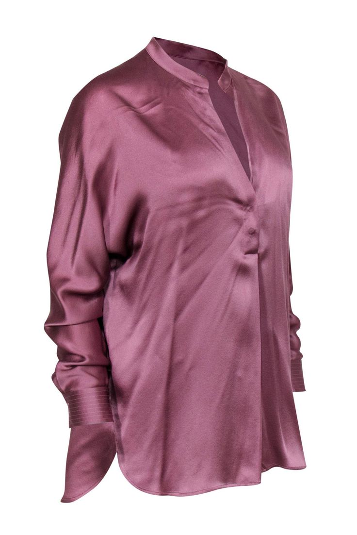 Go soft and silky with Vince blouse! Made of luxe silk in a lovely light purple hue, this light and airy beauty is the perfect top to layer with all your polished professional pieces. Whether you’re headed off to your next big meeting or mingling at a networking event, pair this with sleek slacks and a matching blazer and you’ll be one styling and profiling boss lady! Size S 100% Silk Pullover Two buttons on front of neckline Unlined Relaxed silhouette Notch neckline Long sleeve Slight runs in f Elegant V-neck Blouse For Layering, Fall Solid Silk Tops, Purple Long Sleeve Evening Blouse, Pink Elegant Formal Tops, Elegant Pink Formal Tops, Sleek Silk Spring Blouse, Elegant Formal Pink Tops, Sleek Silk Blouse For Daywear, Chic Sheen Tops For Fall