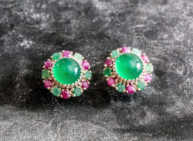 Emerald Earrings set with Created Emerald (centre stone) in a smooth quality & vibrant green color, at 10mm diameter, surrounded with Natural Emerald & Ruby both in diamond cut & natural colors at 3mm each, 8 Carats combined. Victorian Earrings design made of Solid 925 Sterling Silver  ☞ made to last. Matching Ring: www.etsy.com/listing/292194153 Matching Pendant - please ask me May & July Birthstone - Genuine & Natural Stone  ❀ ⌛ Last pair of earrings left ⌛    For Pierced Ears - has a pin that Fine Jewelry Green Cabochon Earrings, Green Round Fusion Earrings, Green Emerald Multi-stone Earrings, Green Multi-stone Gemstones For Jewelry Making, Green Multi-stone Earrings For Anniversary, Green Multi-stone Earrings For Gift, Green Statement Earrings, Emerald Halo, Vintage Inspired Earrings