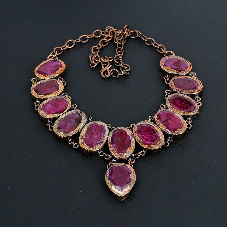 Kashmiri Red Ruby Necklace, Handmade Necklace, Electroformed Copper Necklace, Gemstone Jewelry, Adjustable Chain Necklace, Anniversary Gifts Welcome to our little shop, where you can find handmade copper wire jewelry and more, for you and your loved ones. We do accept custom orders also, kindly message us for more. Gemstone: Kashmiri Red Ruby Metal: Copper  * Protection:- Copper will be tarnished after a while so try to limit contact with lotions, soaps or anything moist and never wear it in the shower, swimming or anywhere else it may come in contact with water. If tarnish becomes an issue, you may clean this item with jewelry cleaning cloth or ultra polishing pads. * Packing:- Your jewelry arrived in a beautiful gift box stored in bubble wrap for safe travel. * Rush your order: Please co Handmade Red Round Crystal Necklaces, Ruby Gemstone Party Necklaces, Red Necklaces For Mother's Day Party, Red Necklace For Mother's Day Party, Mother's Day Red Party Necklaces, Unique Handmade Ruby Necklaces, Unique Ruby Gemstone Necklace, Ruby Necklaces For Valentine's Day Gift, Unique Birthstone Necklace For Gift