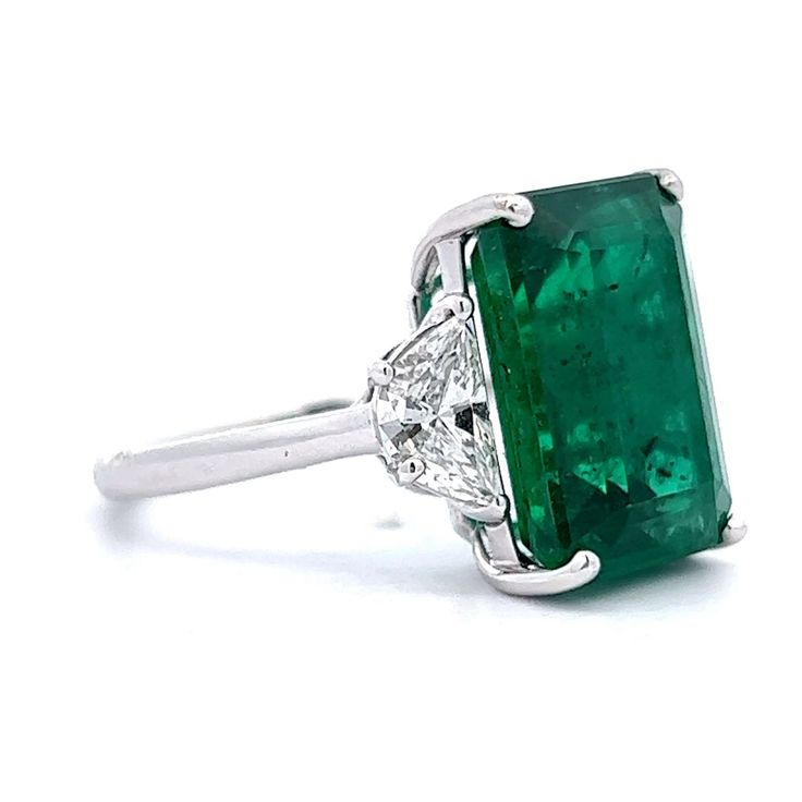 This modern emerald and diamond ring is an absolute stunner. The center stone in this ring is an immaculate 10.02 carat, GIA certified octagonal step cut emerald. The emerald reflects a cool forest green hue. Two half moon cut diamonds weighing 1.24 carats flank the center stone. This rare ring is a true heirloom piece to be passed down from generation to generation. A cocktail right hand ring with sparkle and color. Cool Forest, Moon Cut, Right Hand Ring, Emerald And Diamond Ring, Emerald Diamond Ring, Right Hand Rings, Step Cut, Hand Ring, Metal Shop