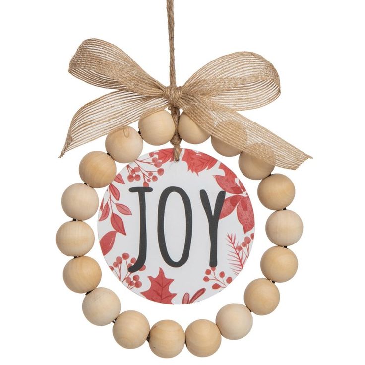 a wooden beaded ornament with the word joy hanging from it's front