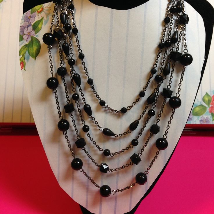 ~ Beautiful Black Multi Layered Bib Design Multi Shapes Bead Statement Necklace ~ Make A Bold Statement With This Striking Beautiful Design Necklace. ~ This Statement Is Versatile That It Can Be Worn With Everything From Casual Wear Like Jeans And T-Shirt, Evening Gowns And Cocktail Dress, & Business Suits. ~ The Material Is Made Of Glass, Plastic And Black Covered Metal Chain/Casting. ~ Length (Top Layer) Approx. 15 Inches And (Extender) Approx. 2.5 Inches ~ Lobster Claw Closure. Black Multi-strand Necklaces For Formal Occasions, Black Multi-strand Necklace With Faceted Beads, Formal Multi-strand Black Beaded Necklaces, Black Multi-strand Jewelry For Evening, Formal Black Multi-strand Beaded Necklaces, Formal Multi-strand Black Beaded Necklace, Formal Black Multi-strand Beaded Necklace, Black Beaded Chain Necklaces For Party, Elegant Black Multi-strand Beaded Necklaces