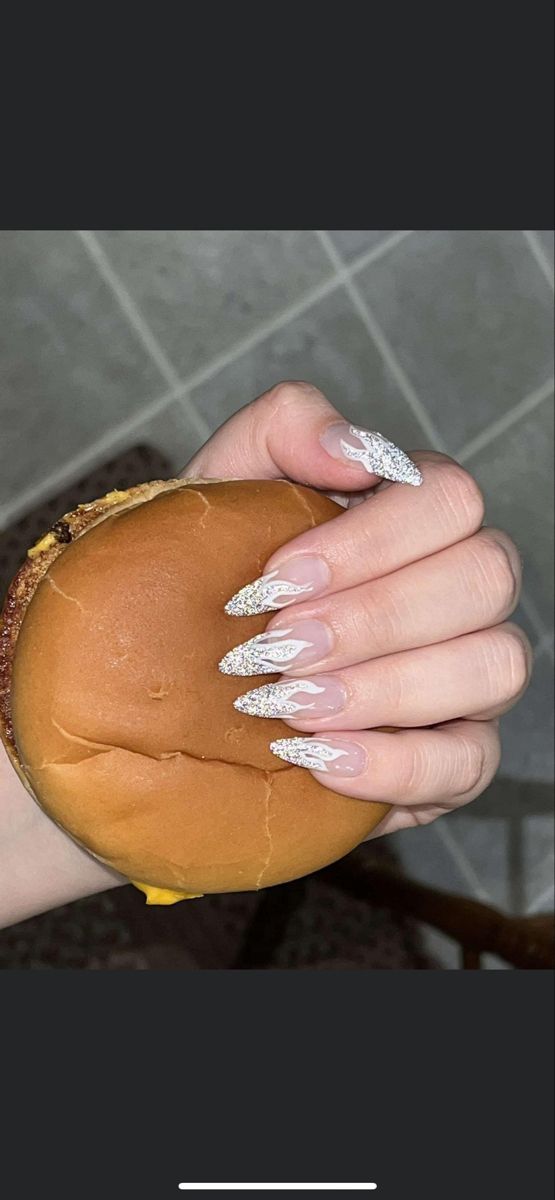 TRENDY WHITE ALMOND SHAPE FLAME NAILS FASHON TREND 2022 SPARKLE GLITTER CUTE Prom Nail Ideas Almond, White Flame Nails, Almond Nails With Glitter, Nail Ideas Almond Shape, Nail Ideas Almond, Prom Nail Ideas, White Almond Nails, Flame Nails, Prom Nail