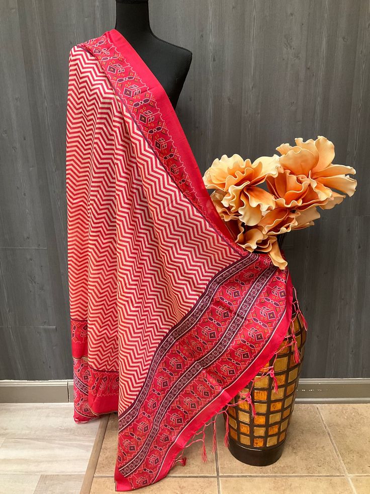 Introducing our stunning Patola Dupatta in stylish green and red color print. This elegant and lightweight dupatta features multi-color prints, making it the perfect fashion statement for any occasion. Whether you're looking for a trendy and stylish addition to your ethnic celebration attire or a classy and daily wear accessory, this dupatta has you covered. It's the ideal choice to elevate your party outfit and add a touch of sophistication to your everyday look. Don't miss out on this must-hav Patola Print, Green And Red, Color Print, Everyday Look, Fashion Item, Fashion Statement, Red Color, Party Outfit, Colorful Prints