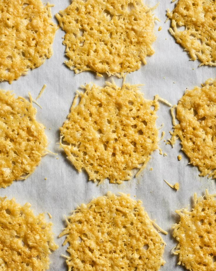 crackers are arranged on a baking sheet to be baked in the oven or used as an appetizer