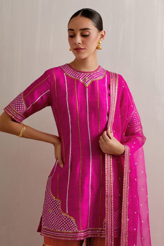 Magenta pink kurta with sequin, zari, aari embroidery in stripe pattern. Paired with red gharara and dupatta. - Aza Fashions Designer Pink Sharara With Dori Work, Pink Straight Kurta Set With Dori Work, Pink Chanderi Sharara With Zari Work, Diwali Pink Palazzo Set With Dori Work, Pink Palazzo Set For Festive Occasions During Eid, Pink Dori Work Kurta For Party, Pink Chanderi Sets With Cutdana, Traditional Pink Palazzo Set With Gota Work, Pink Chanderi Sharara For Party