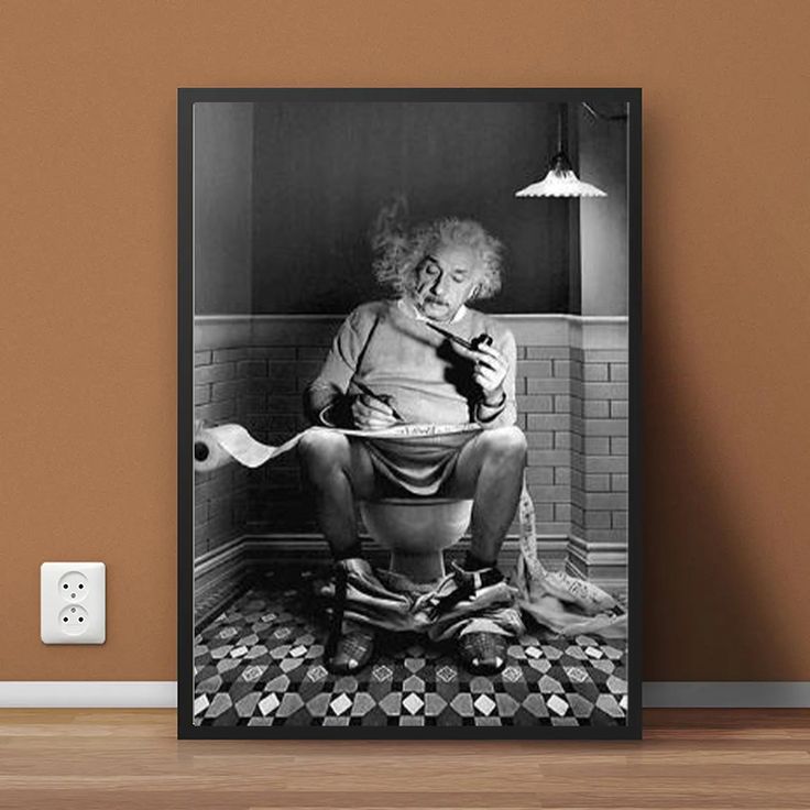 a black and white photo of a man sitting on a toilet with a roll of toilet paper in his mouth