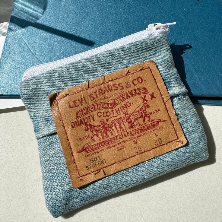 a small blue pouch with a label on it