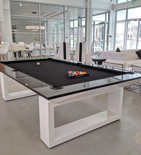 a pool table in the middle of a living room