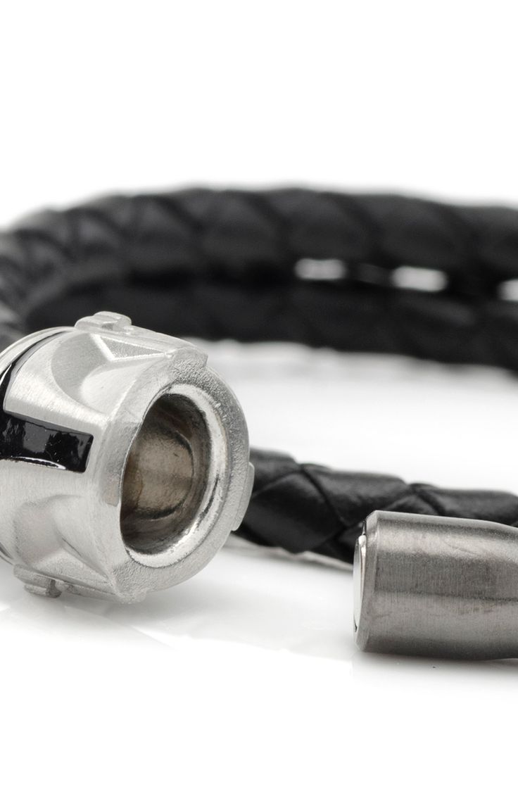 The Force is strong with this braided leather bracelet designed to wrap the wrist twice. 17" length unwrapped; 2 3/8" width Magnetic closure Leather/stainless steel Imported Officially licensed by Lucasfilm Ltd. Leather Bracelet With Stainless Steel Clasp, Leather Bracelet With Palladium Hardware As Gift, Adjustable Gunmetal Bracelets With Stainless Steel Clasp, Adjustable Gunmetal Jewelry With Stainless Steel Clasp, Modern Business Jewelry With Leather Strap, Masculine Braided Leather Bracelet For Gift, Luxury Silver Leather Bracelet With Stainless Steel, Magnetic Leather Bracelet As Gift, Modern Braided Leather Bracelet With Stainless Steel Clasp