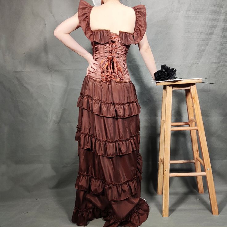 Be a lady of prestige with this steampunk dress. Type: Steampunk dress Material: satin, polyester Color: auburn Choose the size of your dress with the chart below. If you are between two sizes, take the bigger one. Steampunk Overbust Dress For Costume Party, Steampunk Underbust Corset Dress, Steampunk Style Underbust Corset With Ruffles, Steampunk Underbust Corset With Ruffles, Steampunk Corset Dress With Ruffles For Cosplay, Steampunk Costume Dress With Overbust Shape, Steampunk Costume Dress With Overbust, Steampunk Ruffled Corset Dress For Cosplay, Steampunk Overbust Costume Dresses