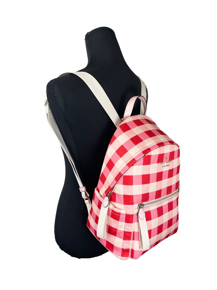 Style: Kate Spade Medium Backpack Material: Nylon Fabric Features: Inner Zip and Slip Pockets, Outer Zip Pocket, Side Outer Slip Pockets, Top Handle, Adjustable Shoulder Straps Measures: 9" W x 13" H x 7.5" D Kate Spade Casual Backpack, Kate Spade Nylon Backpack For Everyday Use, Kate Spade Casual School Backpack, Summer Nylon Backpack, Summer Travel Backpack With Zipper Closure, Casual Kate Spade Bag For School, Kate Spade Nylon Backpack For Everyday, Casual Backpack For On-the-go Use In Spring, Trendy Kate Spade Backpack