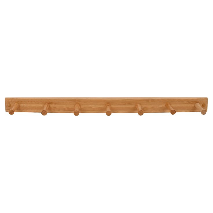 a wooden shelf with five pegs on it's sides and four holes at the top