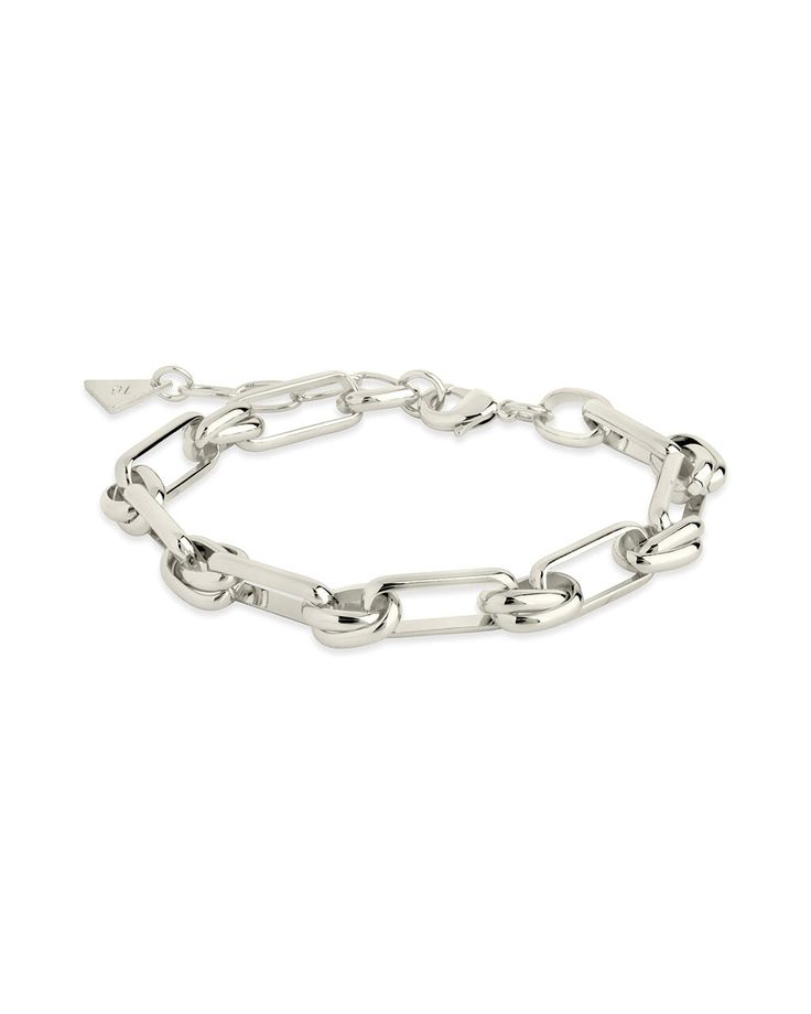 Make a statement with the Wilma Bracelet; crafted with a bold paperlink chain featuring unique links, it is the perfect accessory for adding a touch of modern elegance to any ensemble. Material: 14K gold or rhodium plated brass Features: Measures 7" with 1.25" extender, 0.3" width, Lead & Nickel free, lobster clasp Modern Elegance, Touch Of Modern, Chain Link Bracelet, Silver Bracelets, Link Chain, Link Bracelets, Chain Bracelet, Rhodium Plated, Chain Link