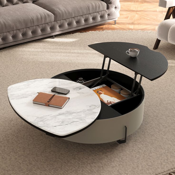 a modern coffee table with an open compartment on the top and a phone in it